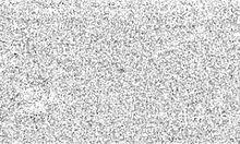 Grainy, white-on-black image showing Halley as a barely distinguishable black dot