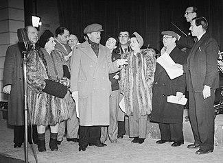 The British comedian Tommy Handley rehearses with actors from his ITMA show (cropped).jpg