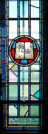 Royal Military College of Canada Saint Raphael’s Roman Catholic Chapel memorial window to John Carson Emblem Bible and Torch.jpg