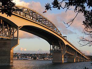 The suburb and Westhaven Marina seen under the Auckland Harbour Bridge from the North Shore.