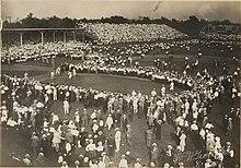 Crowd gathered around St. Louis Cardinals baseball players during the pre-game warm-ups at Robison Field.jpg