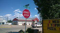 Legal fire hall with a bilingual sign in the foreground.jpg