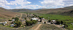 2013-06-16 15 39 22 View south across Mountain City in Nevada, with Nevada State Route 225 visible passing through town and the Owyhee River visible toward the right.jpg