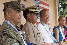 US Navy 061027-M-0049M-001 attend a ceremony marking the completion of an engineering civil action project conducted by U.S. and Philippine Armed Forces.jpg