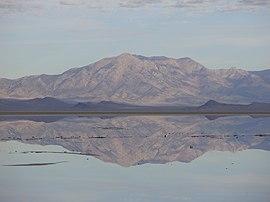 2015-09-29 08 37 08 View of Pilot Peak, Nevada from milepost 18 on Interstate 80 in the Bonneville Salt Flats of Tooele County, Utah, with still waters over the salt flats reflecting the clouds and mountains.JPG