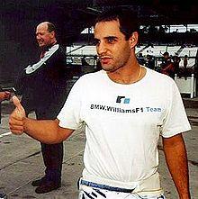Photograph of a young South American man giving a thumbs-up signal