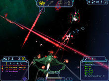 A spacecraft is near the bottom of the screen, heading towards the center. The background is filled with stars and asteroids. Gauges and icons line the top and bottom of the screen.