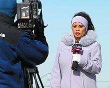 Image of a journalist from CN8 reporting from a scene