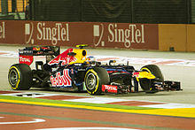 Webber driving for the Red Bull team under lights during the 2012 Singapore Grand Prix