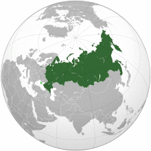 Russia on the globe with Crimea in light green.[a]
