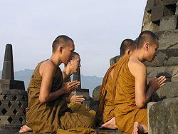Monks praying at Borobudur, the largest Buddhist structure in the world, built by the Sailendra dynasty.
