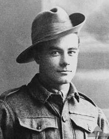 a head and shoulders portrait of a soldier in uniform wearing a broad-brimmed hat turned up on one side