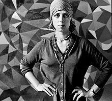 Berenice Sidney Cagnoni in front of one of her paintings, London, 1972.tif.jpg