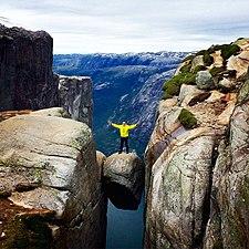 A man standing on Kjeragbolten.jpg