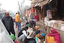 Mallah people in a fish market.jpg