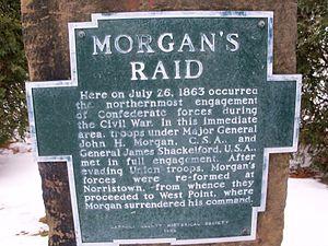 aluminum plaque bolted to sandstone. Plaque is shape of outline of Carroll County, Ohio, with raised letters that read : MORGAN'S RAID Here on July 26, 1863 occurred the northernmost engagement of Confederate forces during the Civil War. In this immediate area, troops under Major General John H. Morgan, C.S.A., and General James Shackleford, U.S.A., met in full engagement. After evading Union troops, Morgan's forces were re-formed at Norristown, from whence they proceeded to West Point, where Morgan surrendered his command. CARROLL COUNTY HISTORICAL SOCIETY 1969