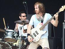 Sharone (left) performing with The Dillinger Escape Plan in 2008