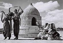 A BUCHARIAN DANCE PERFORMED BY MEMBERS OF THE RINA NIKOVA BALLET IN THE CITADEL IN JERUSALEM. ריקוד בוכרי בביצוע להקת המחול של רינה ניקובה, על רקע חומD827-056.jpg