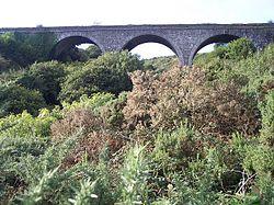 The Halfway Viaduct, on the former Cork, Bandon and South Coast Railway, sits above the village