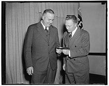 Admiral Byrd admires medal awarded to aide on Antarctic expedition. Washington, D.C., April 27. Rear Admiral Richard E. Byrd admires the gold medal of the National Geographic Society which LCCN2016877888.jpg