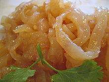 Photo of gold-colored jellyfish strips on plate