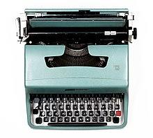 Photograph of a turquoise-blue mechanical typewriter
