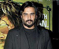 Madhavan posing for the camera at the premiere of his 2016 film Saala Khadoos