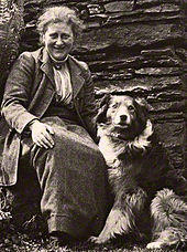 Photograph of an older woman and a dog, dated 1913