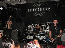Nekromantix performing in 2011. Left to right: Nekroman, Lux, and Mesa