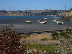 Containers beached on the outskirts of Rodeo, with Vallejo and Cal Maritime in the background