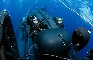 US Navy 050505-N-3093M-007 Members of SEAL Delivery Vehicle Team Two (SDVT-2) prepare to launch one of the team's SEAL Delivery Vehicles (SDV) from the back of the Los Angeles-class attack submarine USS Philadelphia (SSN 690).jpg
