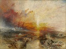 A painting entitled "The Slave Ship" by J. M. W. Turner. In the background, the sun shines through a storm while large waves hit the sides of a sailing ship. In the foreground, enslaved people are drowning in the water, while others are being eaten by large fish
