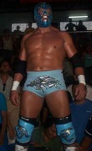 The masked wrestler Dr. Wagner Jr. posing in the ring after a wrestling match.