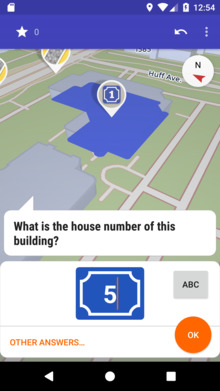 A map with different colored icons on it, currently a quest about a house number