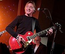 Joey Molland performing with Badfinger in 2014.