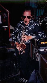 Trosper playing the saxophone