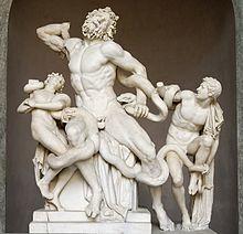 Photograph of a sculpture. A bearded man and two boys fight to free themselves from sea serpents that entangle them.