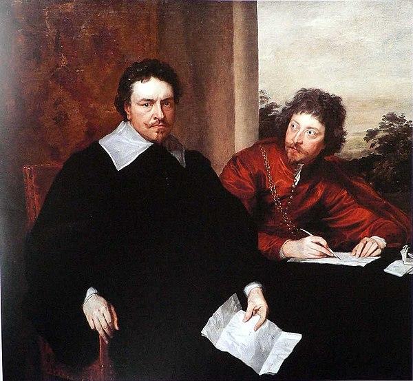 Portrait of a man with short dark hair and a moustache