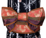 The back view of the chōchō musubi, which resembles a large bow tied at the top edge of the obi.