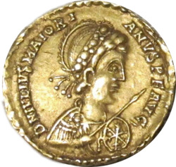 Golden coin depicting man facing right, wearing military garb and wielding a spear and shield