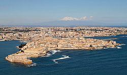 Ortygia island, where Syracuse was founded in ancient Greek times. Mount Etna is visible in the distance.