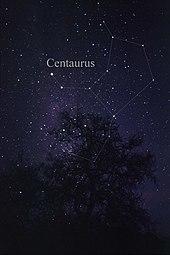 Image of a night sky with stars behind a silhouetted treeline, with several of the brighter stars joined by lines and labelled "Centaurus"