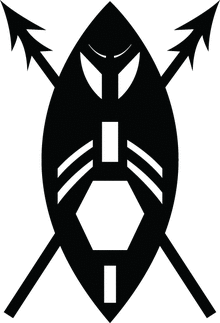 A black and white image of a stylised version of an African shield as a warrior's face with two crossed spears. The shield is encompassed by two circle arcs with white geometric shapes as cut-outs: rectangle at bottom, a larger hexagon (in the position of the mouth), another rectangle (in position of the nose) with two pairs of curved strips (as moustaches), two larger curved sections (in position of the eyes) and two small curved strips (as eyebrows). The spear heads are double pointed.
