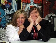 The Allreds embracing one another side-by-side