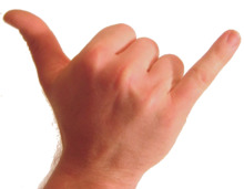 Photo of back of human wrist and hand. The thumb and pinkie are extended and the other fingers are folded against the palm.