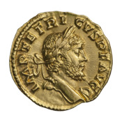 The obverse of a golden coin showing the face of Tetricus.