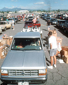 Evacuees from Mount Pinatubo collect supplies during evacuation of Clark Air Base.jpg