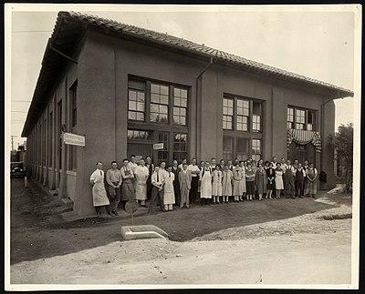 A group of people in front of a building