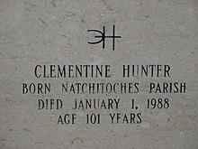 Inscription on gravestone reads. Distinctive signature, backwards C interlocking with H. Clementine Hunter, Born Natchitoches Parish, Died January 1, 1988, Age 101 Years.