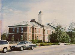 The 1904 Onslow County Courthouse with Highway Patrol car parked on the corner of Old Bridge and Court Streets